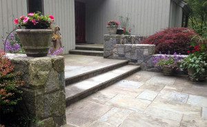A walkway and stairs with beautiful landscaping