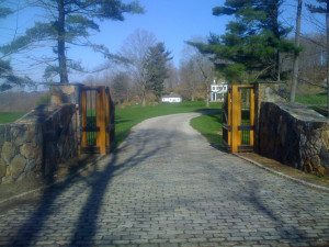 Stone gate entrance to a rural property.